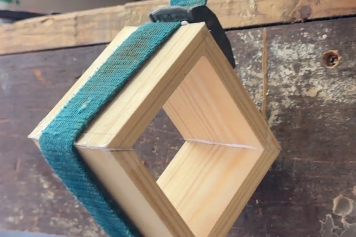 wooden cube frame glued and strapped while drying