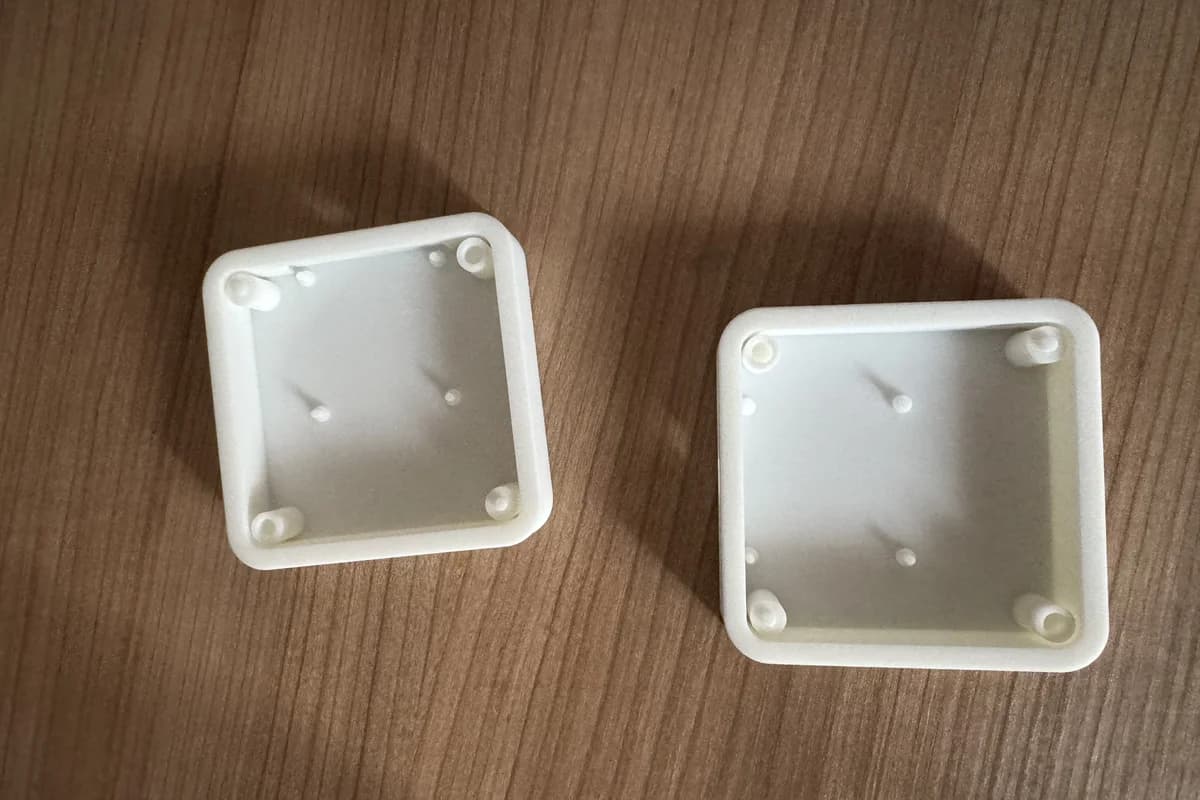 two white 3D-printed halves of the macropad enclosure