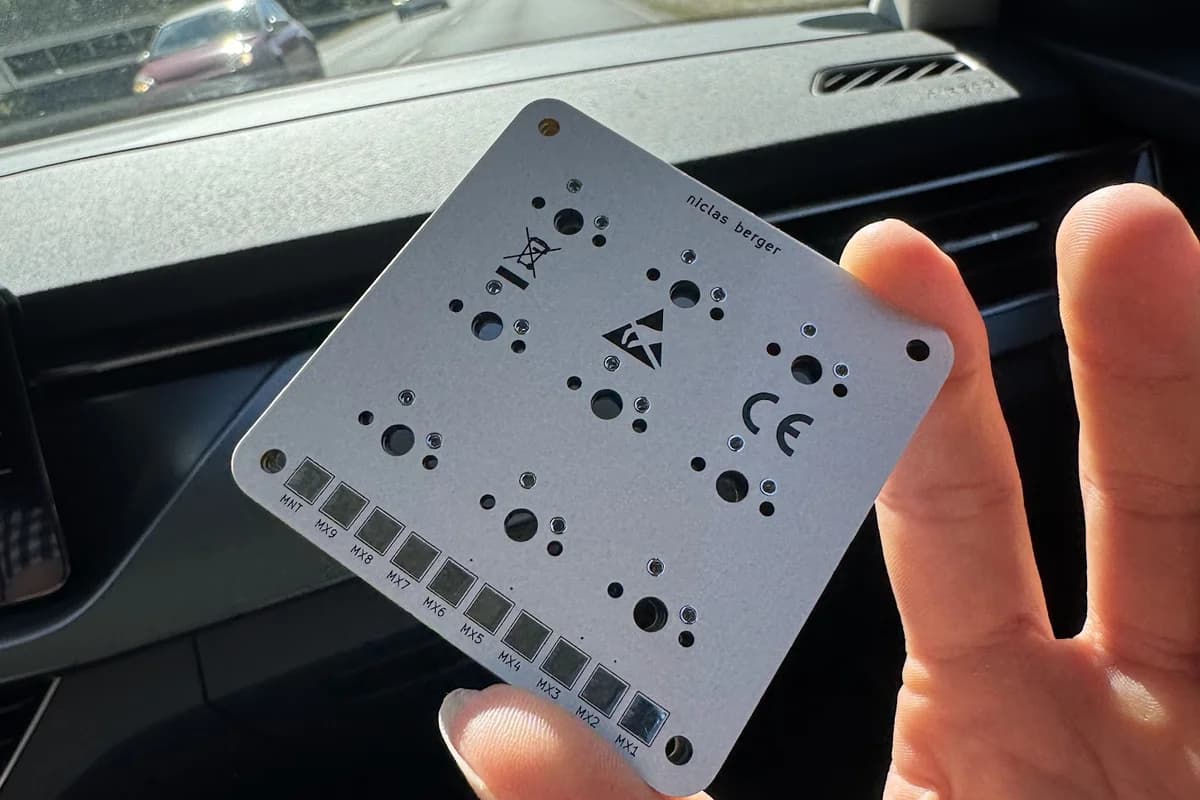 bare macropad PCB with the switch positions and key labels