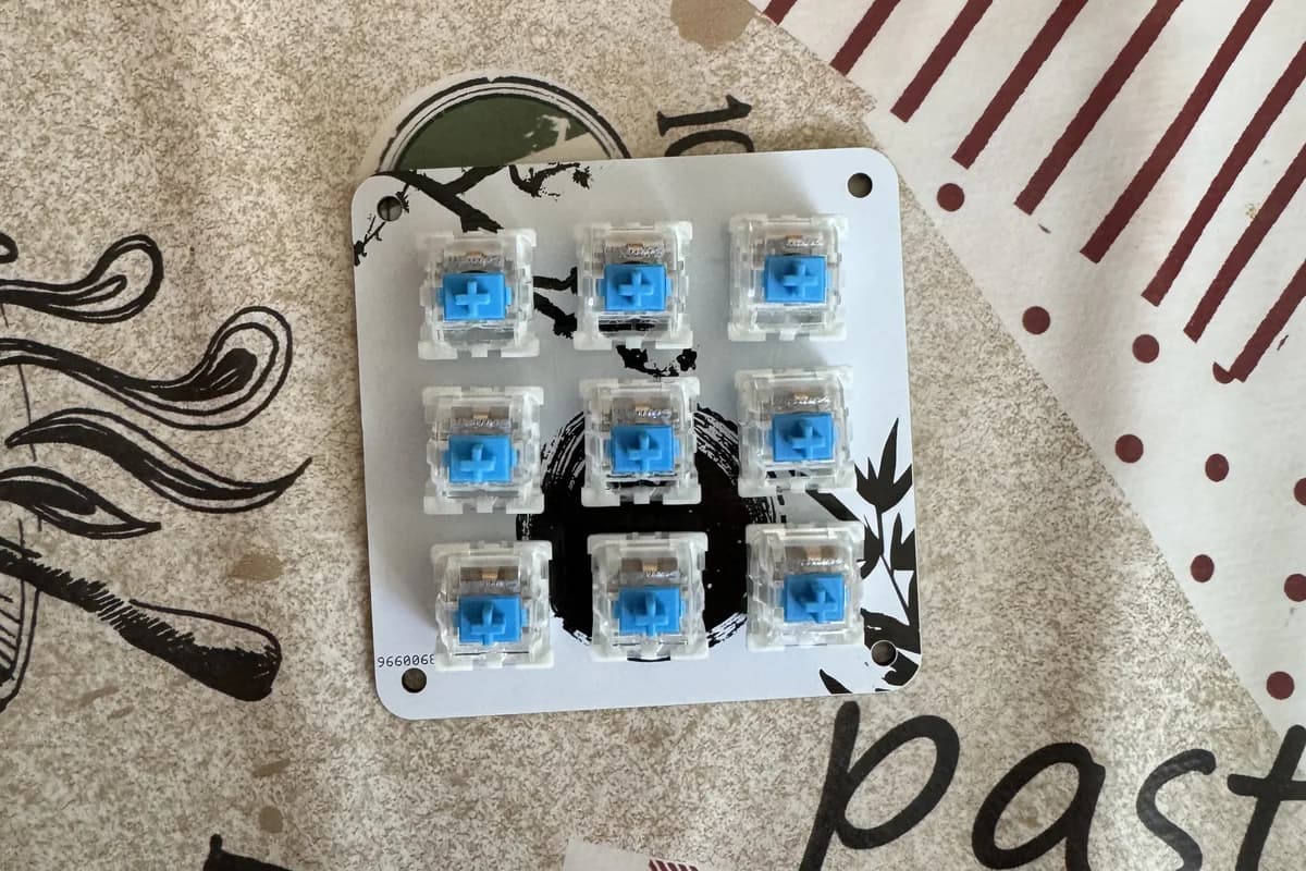nine blue mechanical switches mounted in the macropad plate